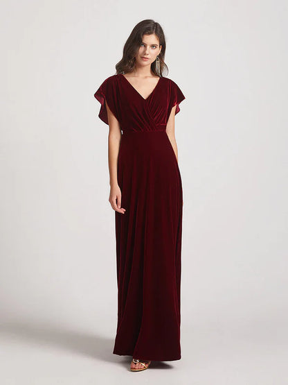 Close-up of the flutter sleeves and velvet fabric on the bridesmaid dress.