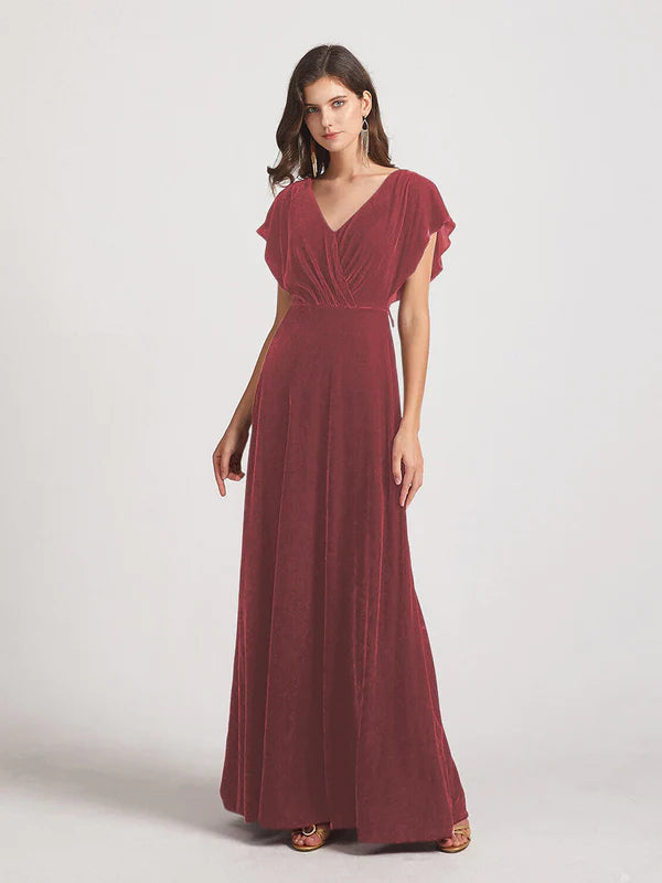 Terracotta velvet flutter sleeve open back bridesmaid dress.