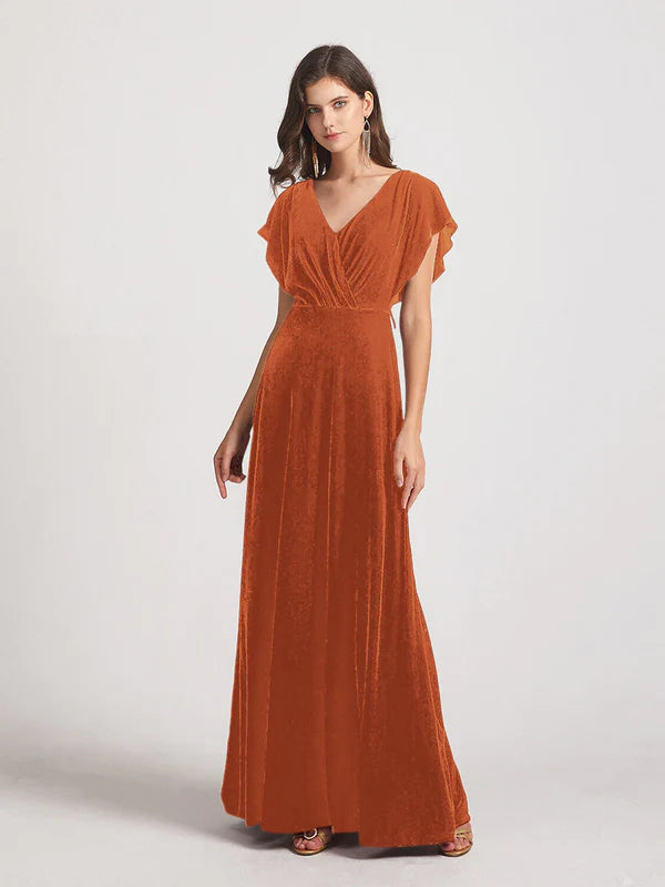 Burnt orange velvet flutter sleeve open back bridesmaid dress.