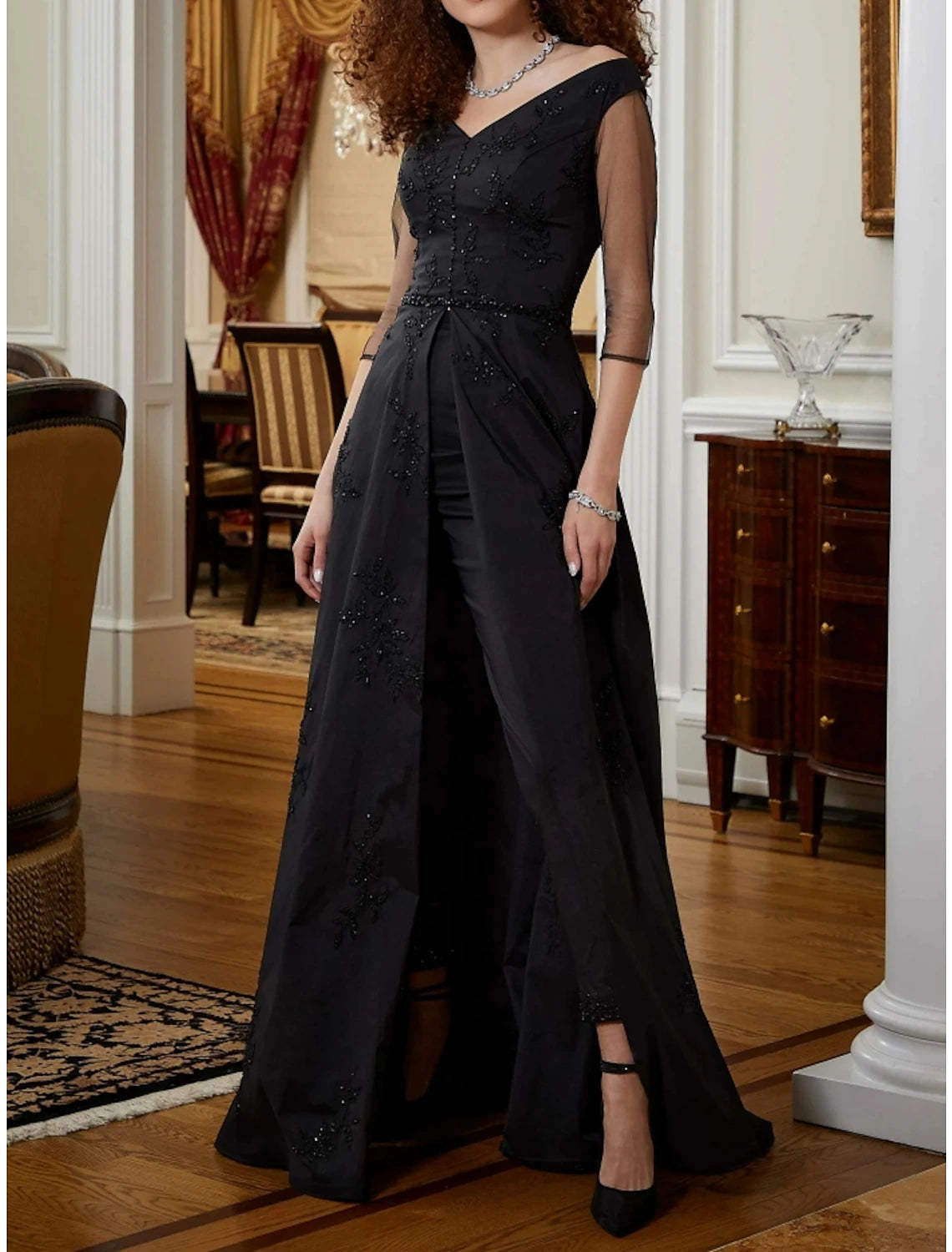 Elegant V-neck half sleeve jumpsuit gown with sequin ruching and sweep train.