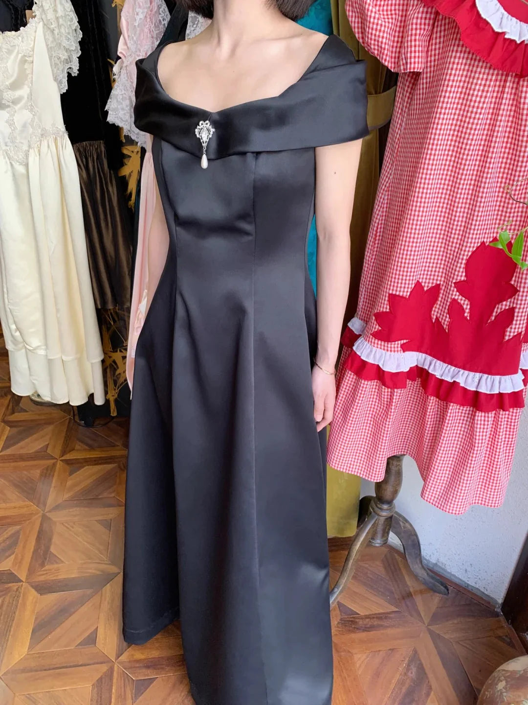 Elegant Black Off The Shoulder Prom Dress With Satin Fabric Pearl Brooch And A Line Skirt For Formal Evening Party