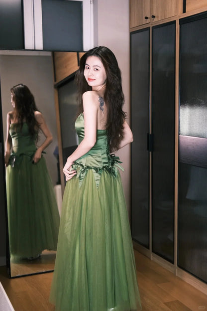 Elegant Green Strapless Prom Dress With Satin Bodice Bow Accents And Tulle Ball Gown Skirt For Formal Evening Party