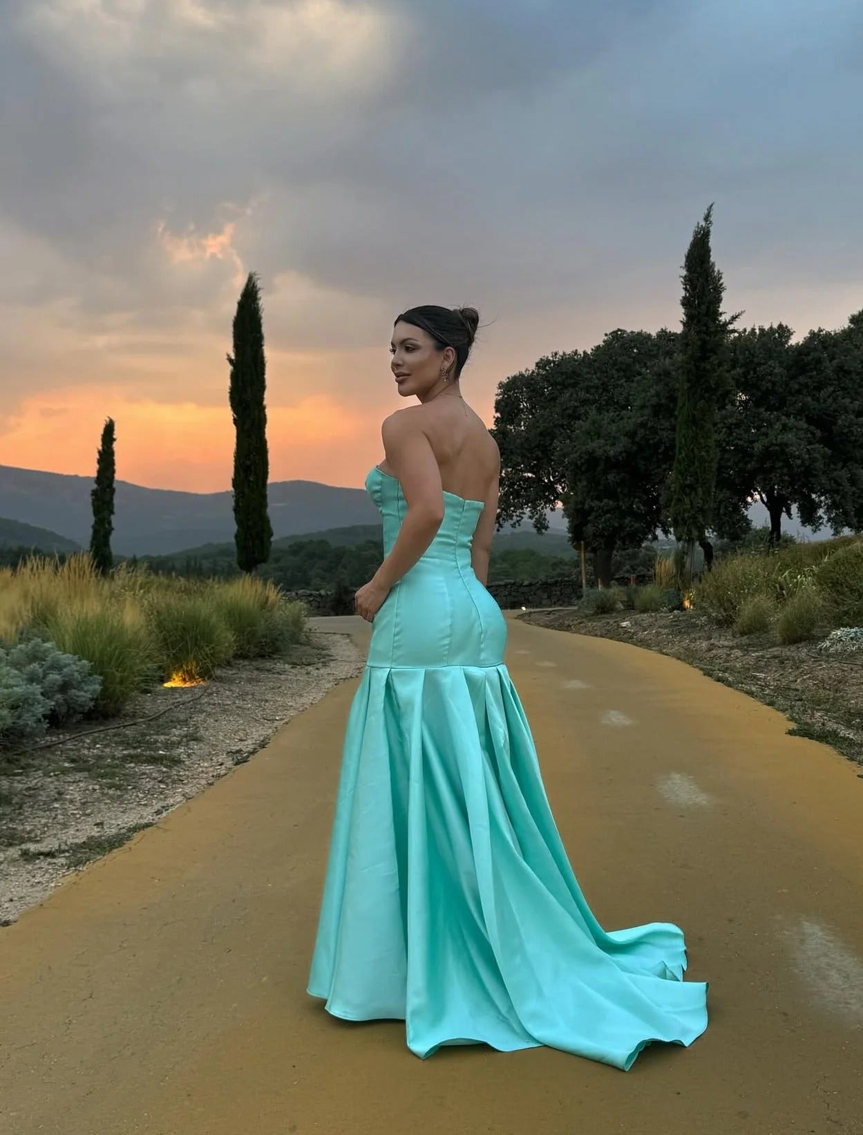 Elegant Strapless Deep V Neck Satin Mermaid Train Prom Dress with Structured Bodice and Flowing Pleated Skirt