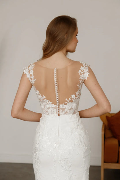 Elegant Mermaid Deep V-Neck Cap Sleeve Lace Sheer White Floor Wedding Dress