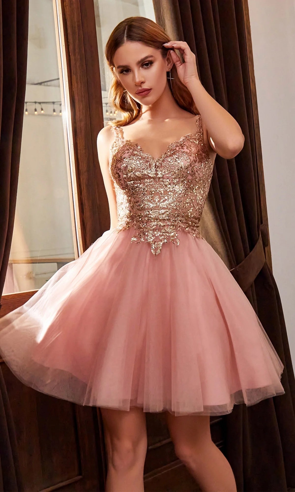 Short A-line homecoming dress with sweetheart neckline, spaghetti straps, gold lace corset bodice, and pink tulle skirt.