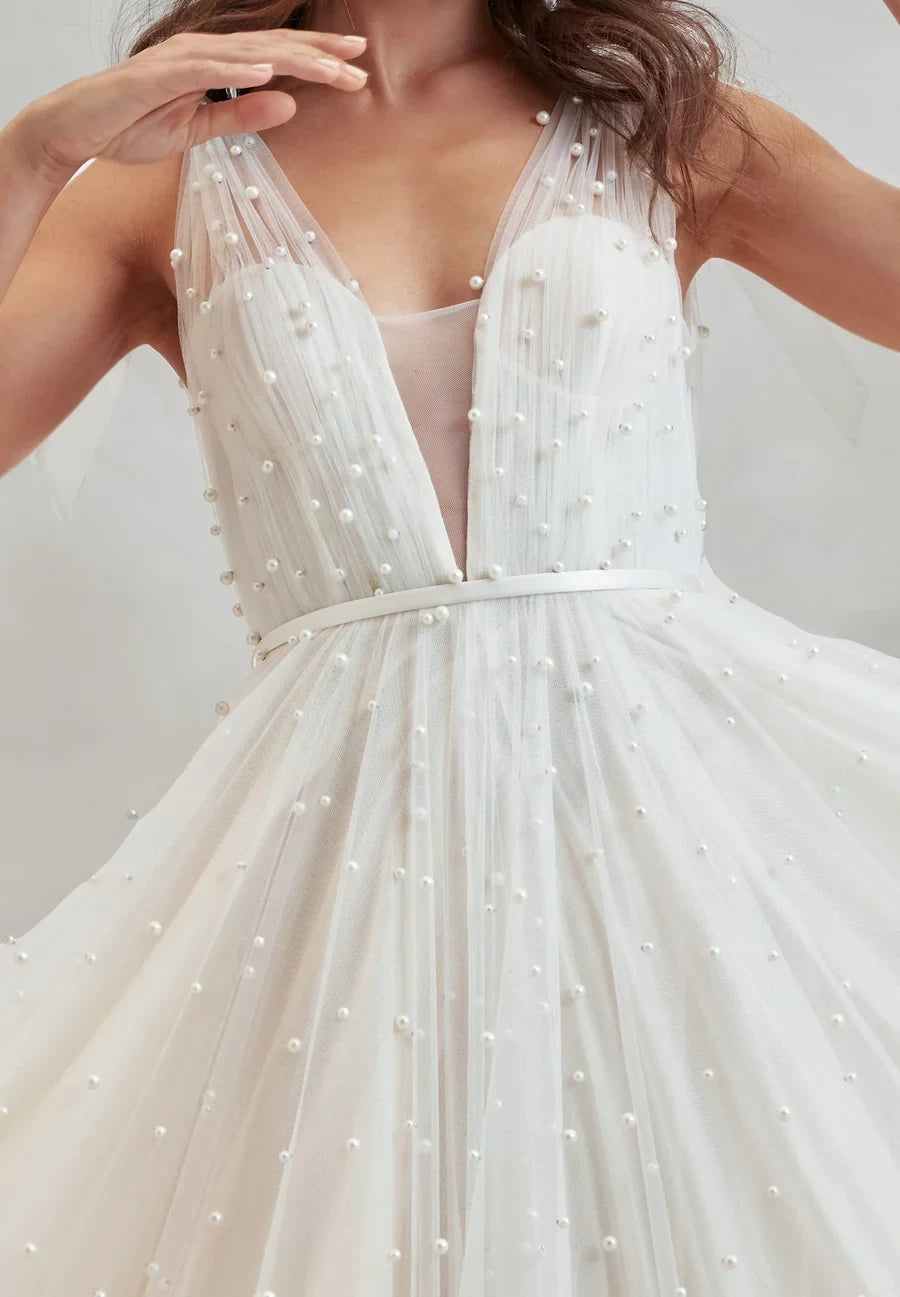 Ethereal A-Line V-Neck Sleeveless Pearl Embellished White Floor-Length Wedding Dresses