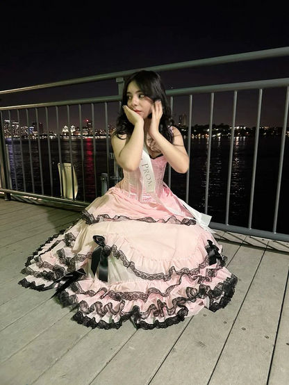 Evening Dress Sleeveless Pink Tulle Ball Gown with Corset Bodice Tiered Ruffle Skirt  Black Lace Trim and Bow Accents