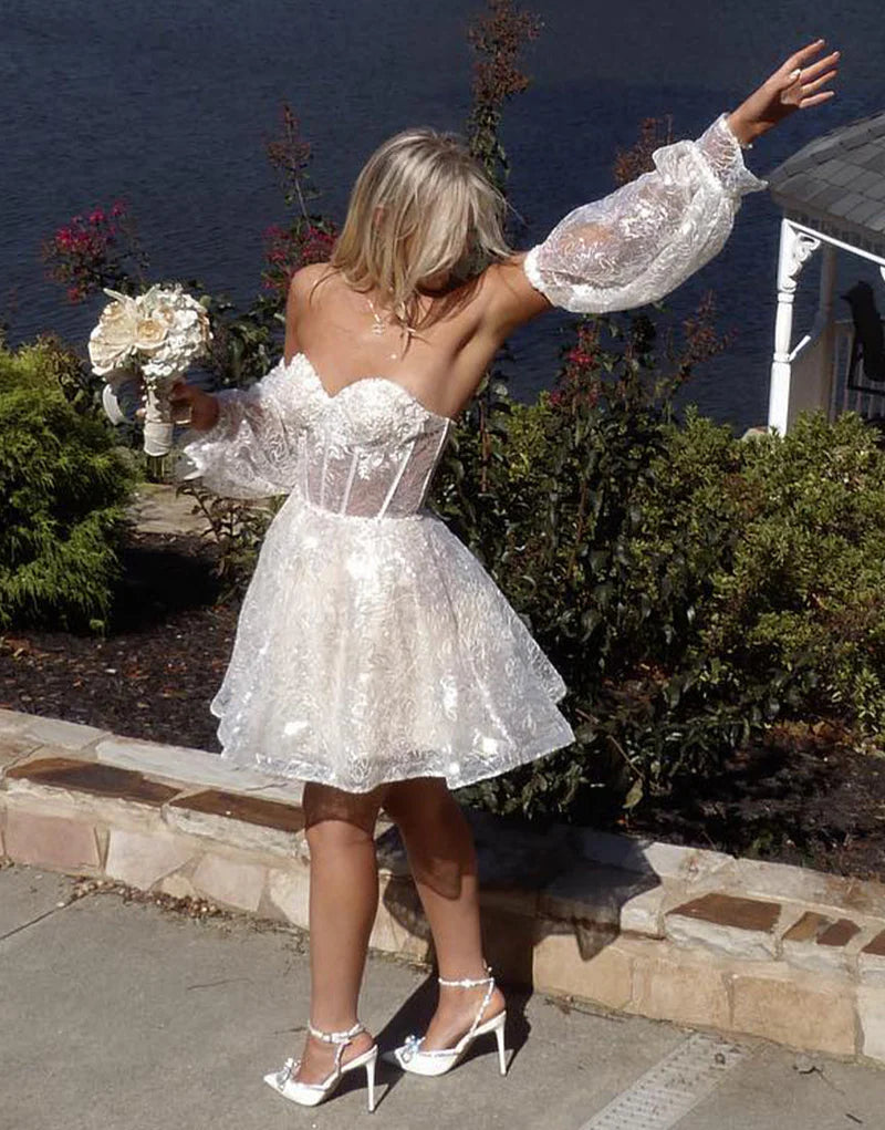 Model in red A-line sweetheart mini homecoming dress.