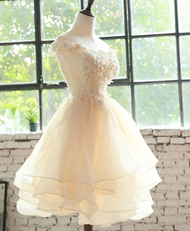 Back view of Koutun floral organza short dress, showcasing layered skirt.
