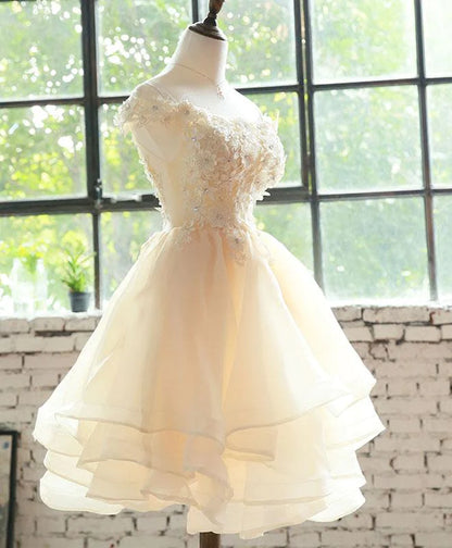 Back view of Koutun floral organza short dress, showcasing layered skirt.