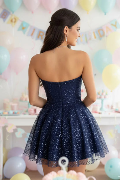 Back view of navy blue sequin mini dress, showing A-line silhouette.
