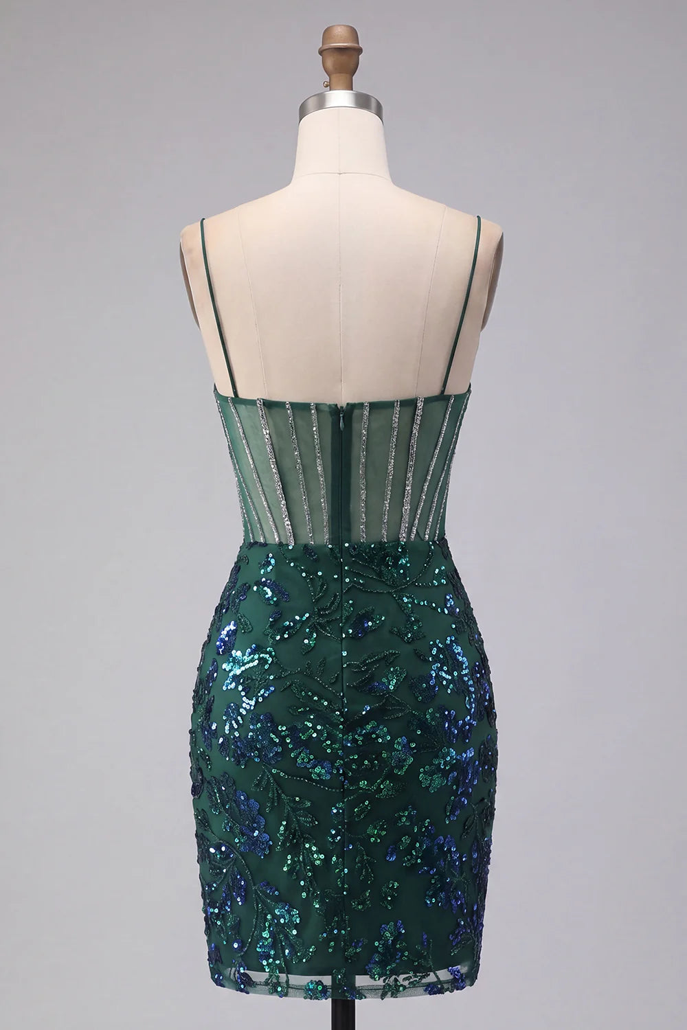Close-up of the sequin floral corset on a dark green homecoming dress.
