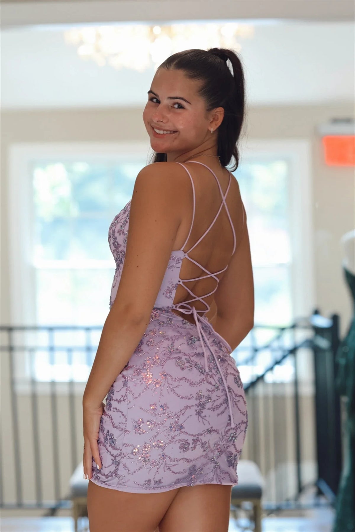 Full length view of the pink sequin bodycon dress with double straps.