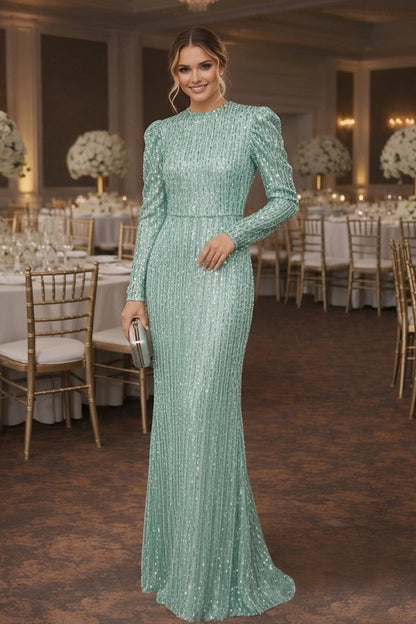 Woman in a glamorous high neck long sleeve sequin mermaid gown.