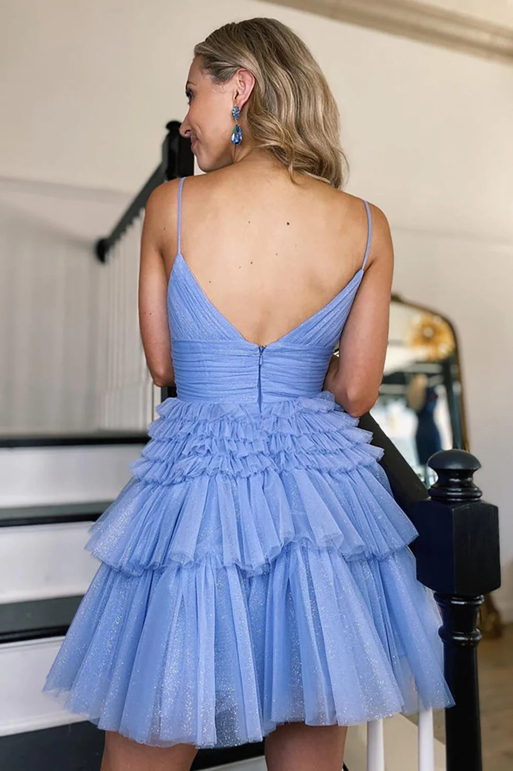 Side view of a lilac strapless sequined short party dress.