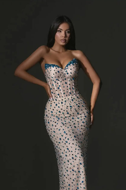 Glamorous Nude Strapless Mermaid Gown with Blue Crystal Embellishments: Prom Dress