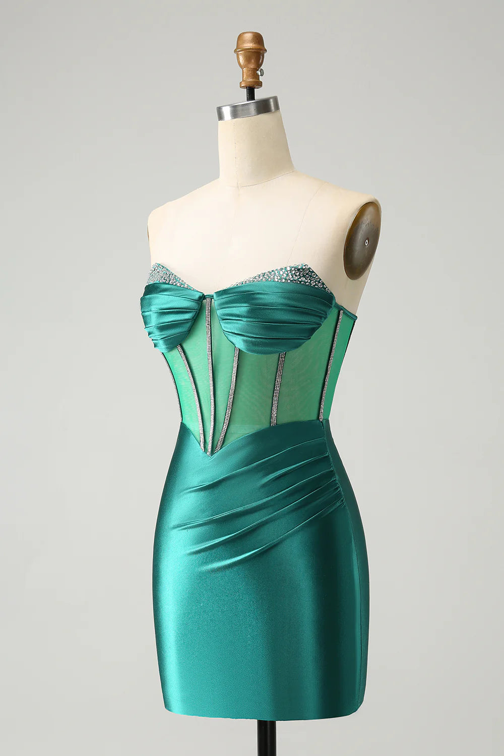 Side view of a dark green glitter strapless tight dress.
