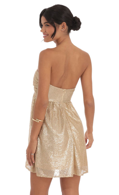 Gold Sequin Strapless Homecoming Dress with Twisted Front Detail and Flared Skirt for Formal Events and Evening Occasions