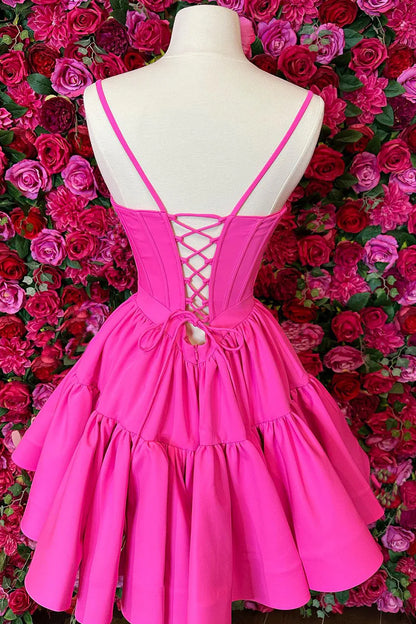 Back view of the hot pink A-line dress, showcasing the lace-up detail.