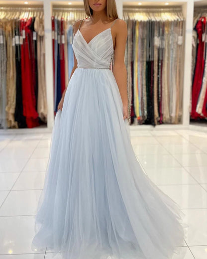 Light Blue Spaghetti Strap Prom Dress With Beaded Bodice Low Open Back And Flowy Tulle A Line Formal Prom Dress