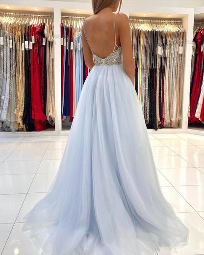 Light Blue Spaghetti Strap Prom Dress With Beaded Bodice Low Open Back And Flowy Tulle A Line Formal Prom Dress