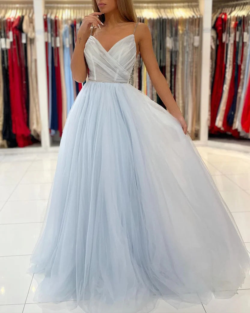 Light Blue Spaghetti Strap Prom Dress With Beaded Bodice Low Open Back And Flowy Tulle A Line Formal Prom Dress