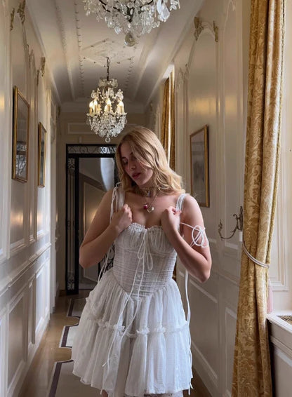 Full length view of the white lace corset dress, showcasing its romantic silhouette.
