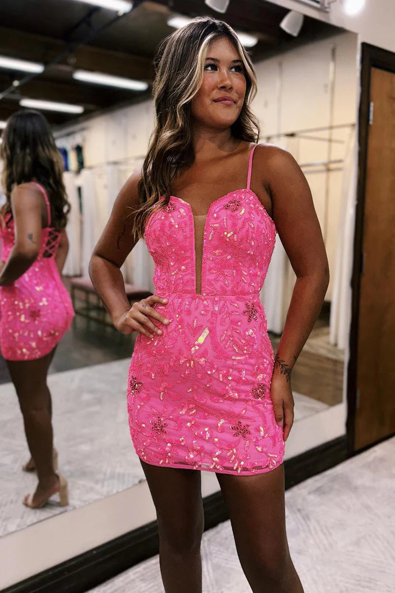 Front view of a woman wearing a short ink homecoming dress with a deep V-neck.