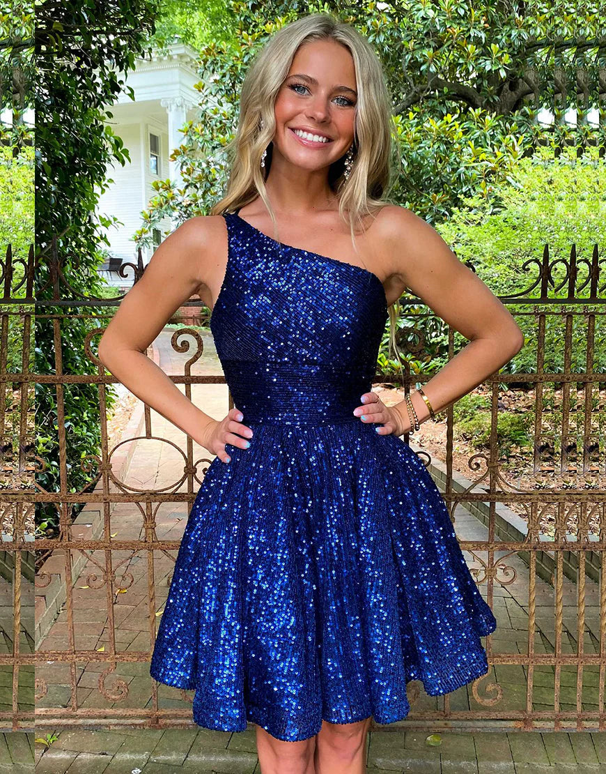 Model wearing a shimmering blue sequin A-line mini dress with a backless design.