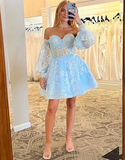 Back view of the blue A-line sweetheart dress, showcasing removable sleeves.