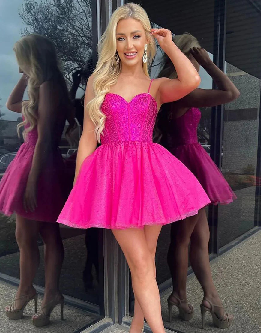 Side view of hot pink A-line dress with glitter and beading.