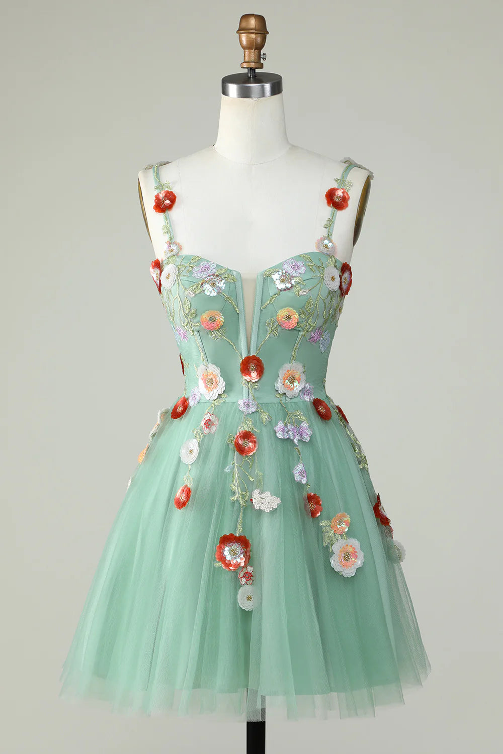 A-line mini dress with spaghetti straps and sequin details.