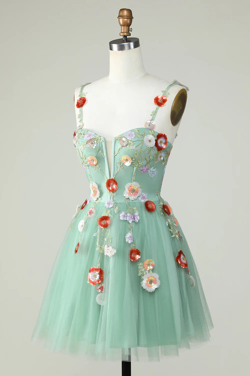 Side view of A-line mini dress with spaghetti straps and sequin details.