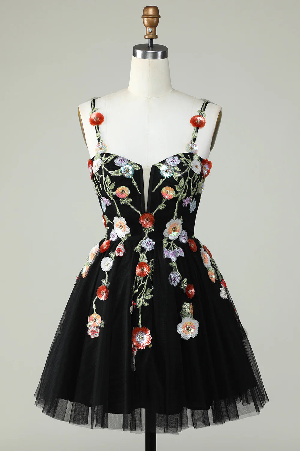 Front view of black A-line mini dress with spaghetti straps and sequin details.