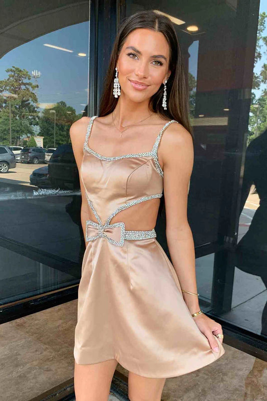 Close-up of the sparkling fabric and cutout design on the homecoming dress.