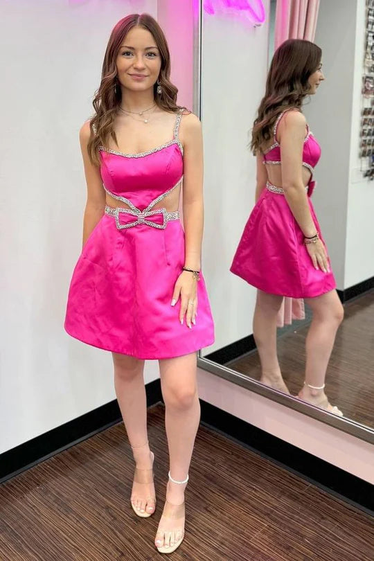 Side view of the sparkling homecoming dress with cutout and bow.