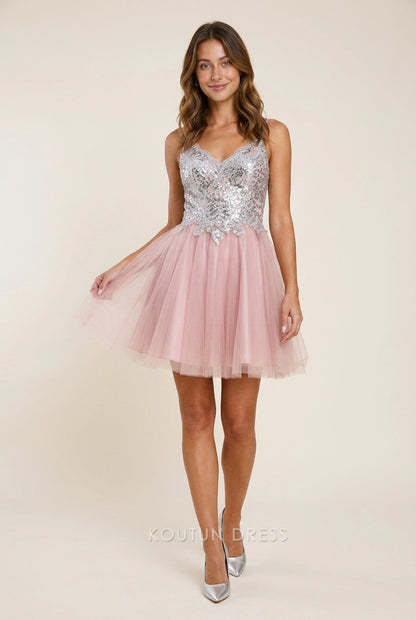 Model wearing a sparkling silver sequin and blush tulle A-line V-neck short homecoming dress.