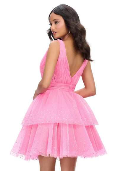 Model wearing a hot pink V-neck sleeveless glitter tulle tiered mini homecoming dress.