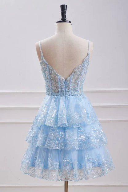 Back view of a light blue sequin dress with delicate spaghetti straps.