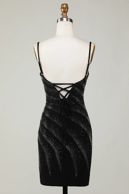 Close-up of the sparkling embellishments on the black V-neck dress.