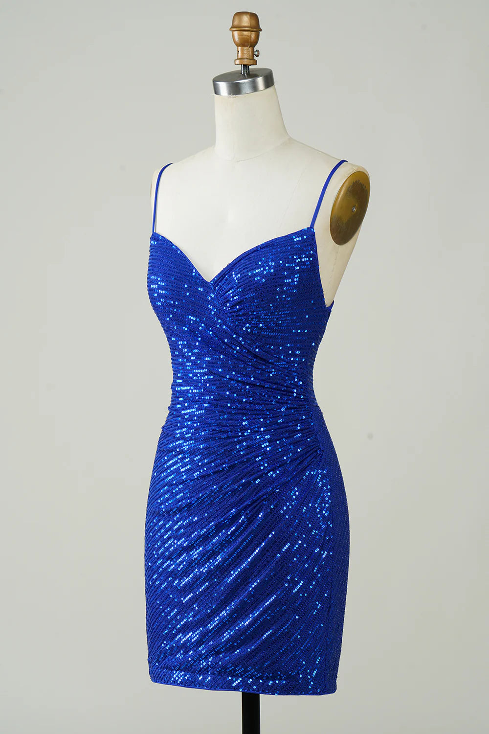 Side view of a sparkling royal blue sequin homecoming dress.
