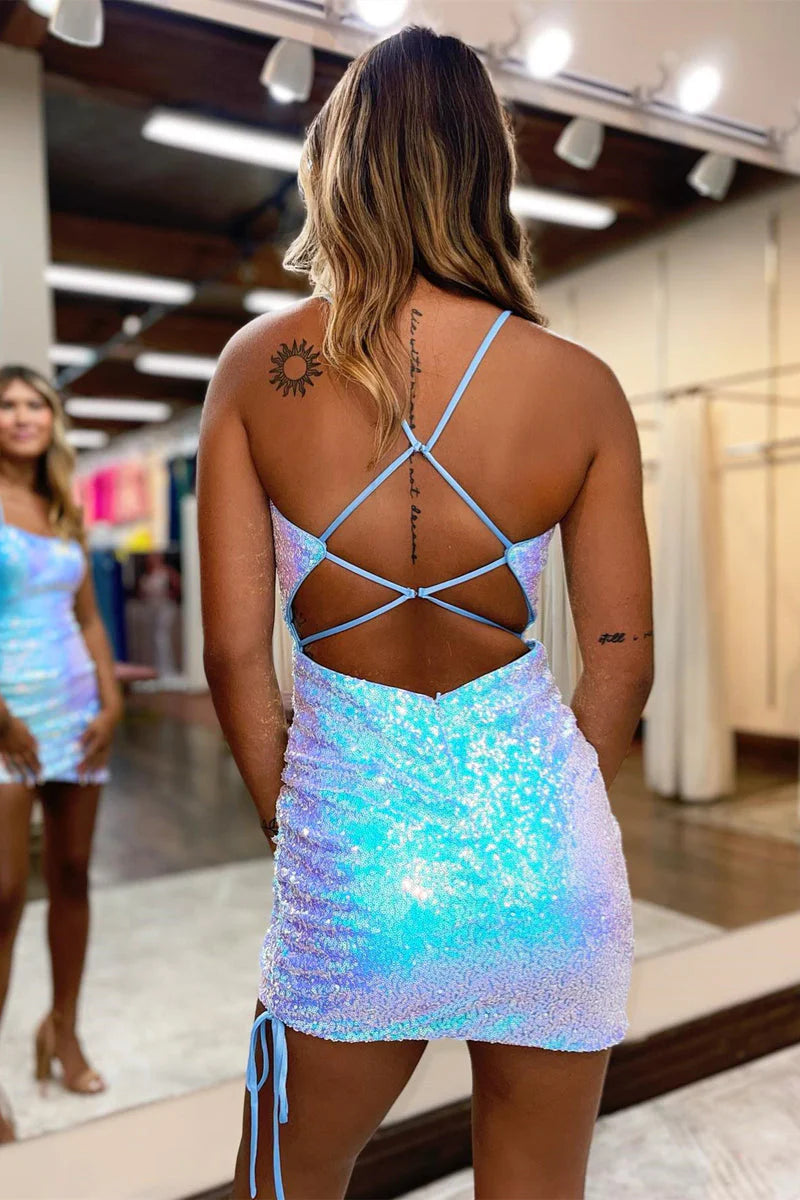 Back view of a blue iridescent sequin sheath dress, highlighting the lace-up detail.
