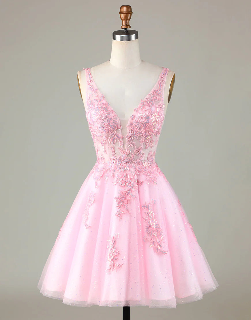 Model wearing a sparkling pink glitter A-line homecoming dress with appliques.