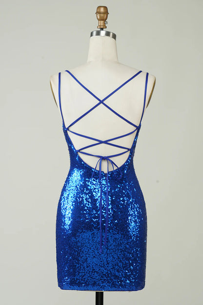 Side view of a model in a royal blue sequin backless mini dress.
