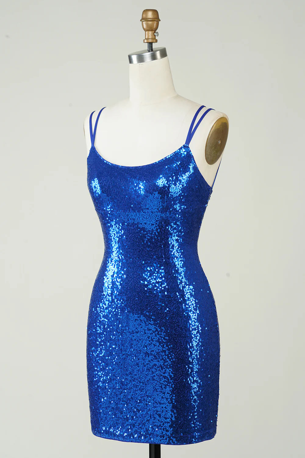 Back view of a royal blue sequin mini dress, highlighting the backless design.