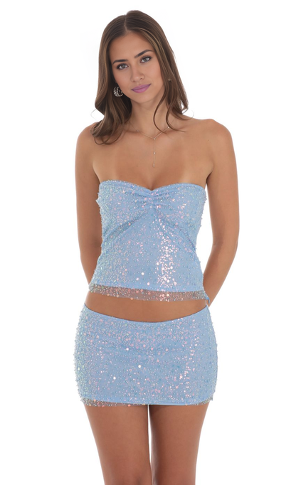 Model wearing a sparkling sequin beaded two-piece short homecoming dress with a sweetheart neckline.