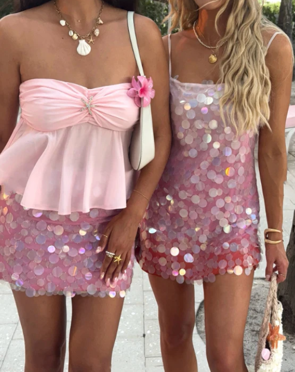 Back view of a sparkling pink sequin short cocktail dress.