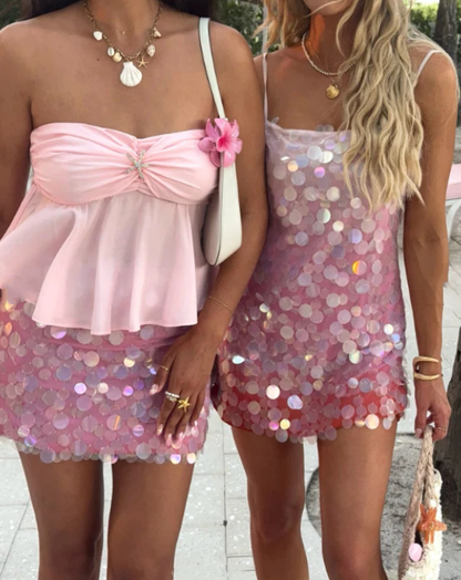 Back view of a sparkling pink sequin short cocktail dress.