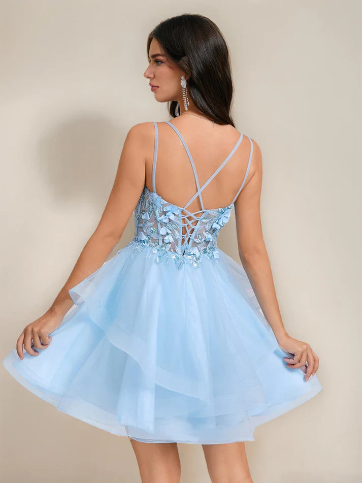 Back view of a pink sequined short homecoming dress with delicate embroidery.