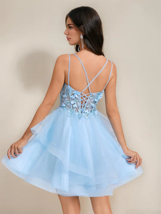 Back view of a pink sequined short homecoming dress with delicate embroidery.